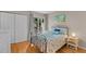 Inviting bedroom with wood floors, closet space, and nautical decor at 1627 Live Oak Park, Seabrook Island, SC 29455