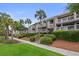 Attractive condo building featuring well-maintained landscaping, inviting staircases, and private balconies for each unit at 1627 Live Oak Park, Seabrook Island, SC 29455
