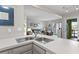 This well-equipped kitchen includes stainless steel sinks and opens up to the adjacent living area at 1627 Live Oak Park, Seabrook Island, SC 29455