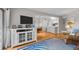Stylish living room with an entertainment center, offering a seamless flow to the dining area and kitchen at 1627 Live Oak Park, Seabrook Island, SC 29455