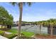 Scenic view of well-maintained tennis courts surrounded by lush greenery and palm trees, offering a vibrant recreational setting at 1627 Live Oak Park, Seabrook Island, SC 29455