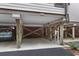 View of the home's undercarriage displaying structural wooden support beams and parking area with a vehicle at 1627 Live Oak Park, Seabrook Island, SC 29455