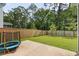 An expansive backyard featuring a concrete patio, partial privacy fence, and lush green grass at 174 Red Bluff St, Summerville, SC 29483