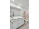 Bathroom with double vanity, large mirror and neutral colored tile floor at 174 Red Bluff St, Summerville, SC 29483