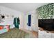 Bedroom with a large window for natural light, closet and television at 174 Red Bluff St, Summerville, SC 29483