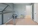 Light blue bedroom featuring a decorative bed frame, chair, bookshelf, and carpeted floors at 174 Red Bluff St, Summerville, SC 29483