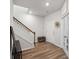 Hallway with wood floors and white trim leading to other rooms in the house at 174 Red Bluff St, Summerville, SC 29483