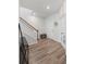 Hallway with wood floors and white trim leading to other rooms in the house at 174 Red Bluff St, Summerville, SC 29483