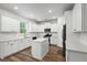 Modern kitchen featuring white cabinets, stainless steel appliances, and a center island at 174 Red Bluff St, Summerville, SC 29483