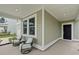 Inviting porch area featuring comfortable seating, perfect for relaxing outdoors at 174 Red Bluff St, Summerville, SC 29483