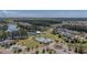 Stunning aerial view of the community, highlighting the pool, clubhouse, pond and numerous residences at 183 Calm Water Way, Summerville, SC 29486