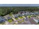 Aerial view of a neighborhood and home with trees and pond in the background at 183 Calm Water Way, Summerville, SC 29486