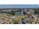 Gorgeous aerial view capturing the community's pool, surrounding homes, expansive lawns, and serene pond at 183 Calm Water Way, Summerville, SC 29486