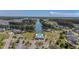 Picturesque aerial view of the community featuring a pool, clubhouse, pond and houses, offering serene waterfront living at 183 Calm Water Way, Summerville, SC 29486