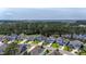 Aerial view of the home in a residential community featuring a lake, green trees and lawns at 183 Calm Water Way, Summerville, SC 29486