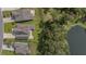 Aerial view of the home and community featuring a lake, trees and green lawns at 183 Calm Water Way, Summerville, SC 29486