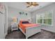 Bedroom featuring neutral walls, a ceiling fan, and a large window at 183 Calm Water Way, Summerville, SC 29486