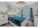 Bright bedroom with french doors, blue bedding, and natural lighting at 183 Calm Water Way, Summerville, SC 29486