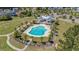 Aerial view showcasing a community pool with ample seating and a pavilion, surrounded by lush landscaping at 183 Calm Water Way, Summerville, SC 29486