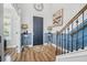 Elegant entryway with hardwood floors, decorative lamps, and a stylish staircase at 183 Calm Water Way, Summerville, SC 29486
