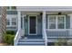 Inviting front porch with decorative lights and plants enhancing curb appeal at 183 Calm Water Way, Summerville, SC 29486