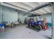 Spacious garage featuring epoxy floors, overhead storage, and a blue golf cart at 183 Calm Water Way, Summerville, SC 29486