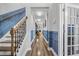 Spacious hallway featuring wood floors, paneled walls, and ample natural light at 183 Calm Water Way, Summerville, SC 29486