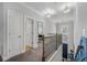 Upstairs hallway features wood and iron railing and two pendant lights at 183 Calm Water Way, Summerville, SC 29486