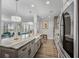 Modern kitchen featuring gray cabinets, stainless steel appliances, and granite countertops at 183 Calm Water Way, Summerville, SC 29486