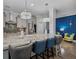 Modern kitchen featuring gray cabinets, stainless steel appliances, granite countertops and eat in bar at 183 Calm Water Way, Summerville, SC 29486