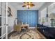 Beautiful home office featuring a stunning blue accent wall, hardwood floors, and bright windows at 183 Calm Water Way, Summerville, SC 29486