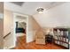 Relax in this attic room with wood floors and chair at 19 Avondale Ave, Charleston, SC 29407