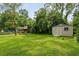 Spacious backyard featuring a utility shed, and a play structure, perfect for Gathering fun at 19 Avondale Ave, Charleston, SC 29407