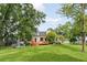 Expansive backyard with a deck, outdoor kitchen, and plenty of space for recreation and entertaining at 19 Avondale Ave, Charleston, SC 29407