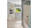 Bathroom featuring a tub/shower combo, tiled flooring, and built in storage at 19 Avondale Ave, Charleston, SC 29407