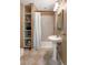 Bathroom features a pedestal sink, a standing shower, and built in storage shelves at 19 Avondale Ave, Charleston, SC 29407