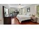 Bright bedroom featuring hardwood floors, natural light, and ample closet space at 19 Avondale Ave, Charleston, SC 29407