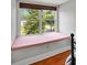 A cozy window seat providing a peaceful retreat with views of the outdoors at 19 Avondale Ave, Charleston, SC 29407