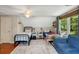 Bedroom with two beds, ceiling fan, and lots of natural light at 19 Avondale Ave, Charleston, SC 29407