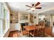 Cozy dining room showcases a fireplace, built-in shelving, and hardwood floors at 19 Avondale Ave, Charleston, SC 29407