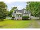 Charming cape cod with dormers, white picket fence, mature landscaping at 19 Avondale Ave, Charleston, SC 29407