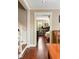 Hallway view with hardwood floors leading to a living room and staircase at 19 Avondale Ave, Charleston, SC 29407