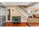 Hallway featuring hardwood floors, a cabinet and stairs at 19 Avondale Ave, Charleston, SC 29407