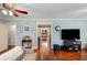 Cozy living room showcasing hardwood floors and seamless transition to dining at 19 Avondale Ave, Charleston, SC 29407