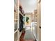 Functional mudroom with laundry area, storage hooks, bench, and convenient access to the backyard at 19 Avondale Ave, Charleston, SC 29407