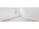 Bright, unfurnished bedroom with neutral carpet, white walls, and a large window at 214 Seele St, Summerville, SC 29485