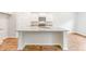 Kitchen island with stainless steel appliances, granite countertops, and white cabinets at 214 Seele St, Summerville, SC 29485