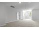 A carpeted bedroom with white walls, and two windows, plus a closet at 222 Seele St, Summerville, SC 29485