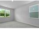Bright, carpeted bedroom with large windows offering serene outdoor views at 222 Seele St, Summerville, SC 29485