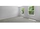 Bedroom with plush carpet and two windows providing plenty of natural light at 222 Seele St, Summerville, SC 29485